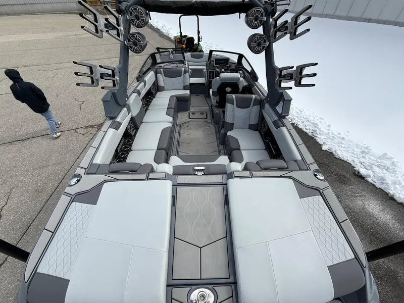 Slide: The Image of 2021 Malibu M240 boat interior with spacious seating and modern design. - 9