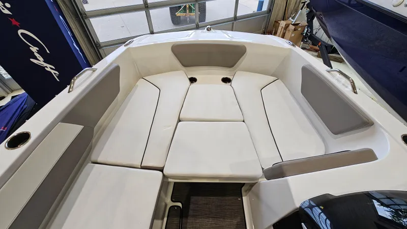 Slide: The Image of 2022 Glastron GTD 180 boat interior with cushioned seating and modern design. - 15