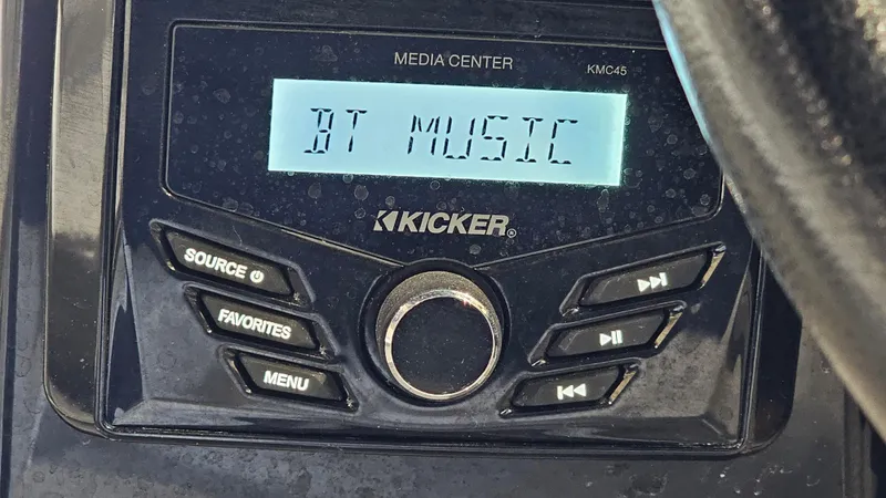 Slide: The Image of Kicker media center displaying "BT Music" in a 2022 Glastron GTD 180 boat. - 19