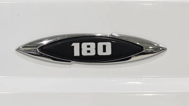 Slide: The Image of 2022 Glastron GTD 180 emblem on white surface, featuring chrome and black design. - 21