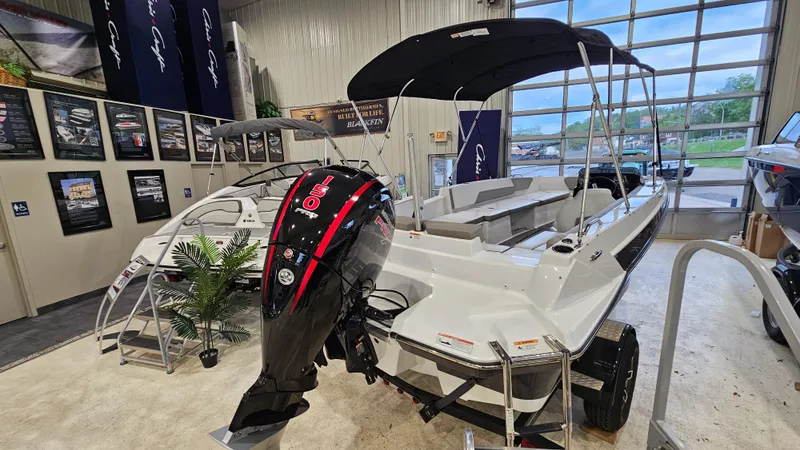 Slide: The Image of 2022 Glastron GTD 180 boat with outboard motor displayed in showroom. - 3