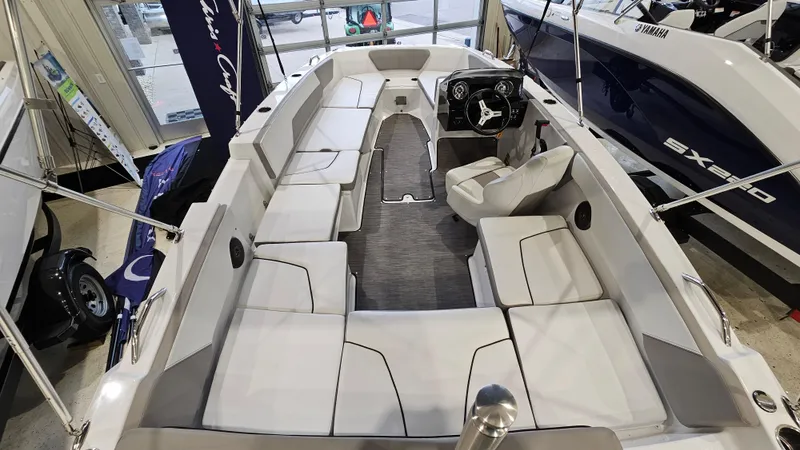 Slide: The Image of 2022 Glastron GTD 180 boat interior with spacious seating and modern dashboard. - 6
