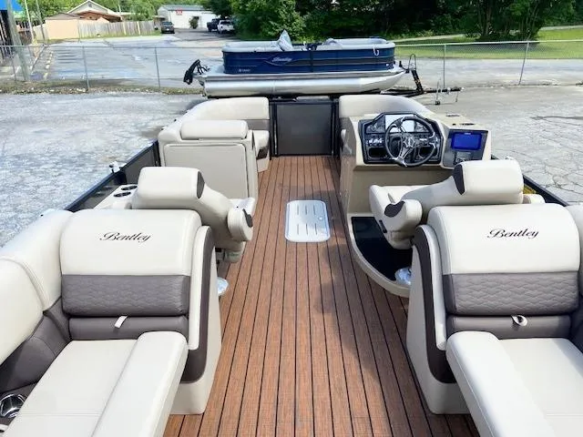 Slide: The Image of 2025 Bentley Pontoons 223 Elite Admiral with luxurious seating and modern dashboard. - 4