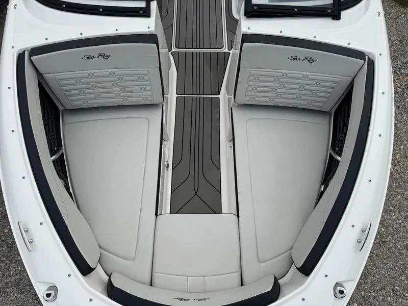Slide: The Image of 2024 Sea Ray SPX 210 OB boat interior with sleek seating and modern design. - 13
