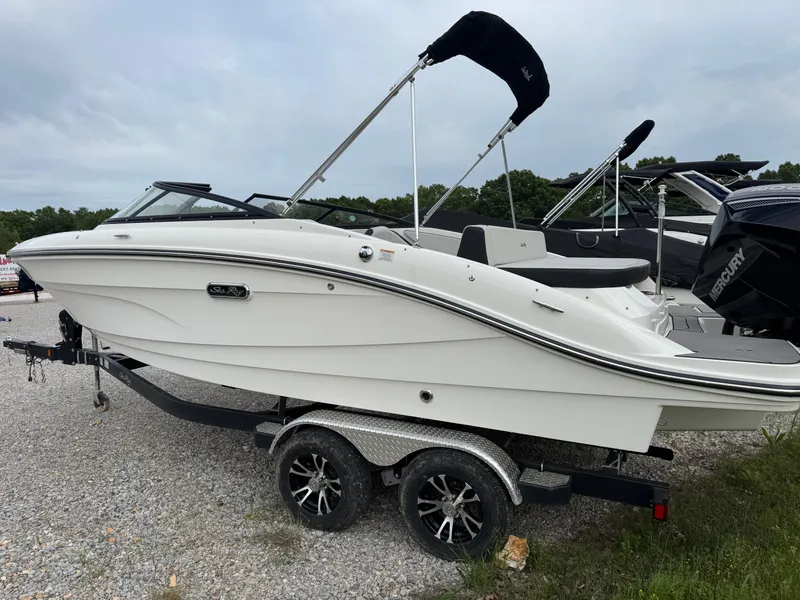 Slide: The Image of 2024 Sea Ray SPX 210 OB boat on trailer, parked outdoors. - 4