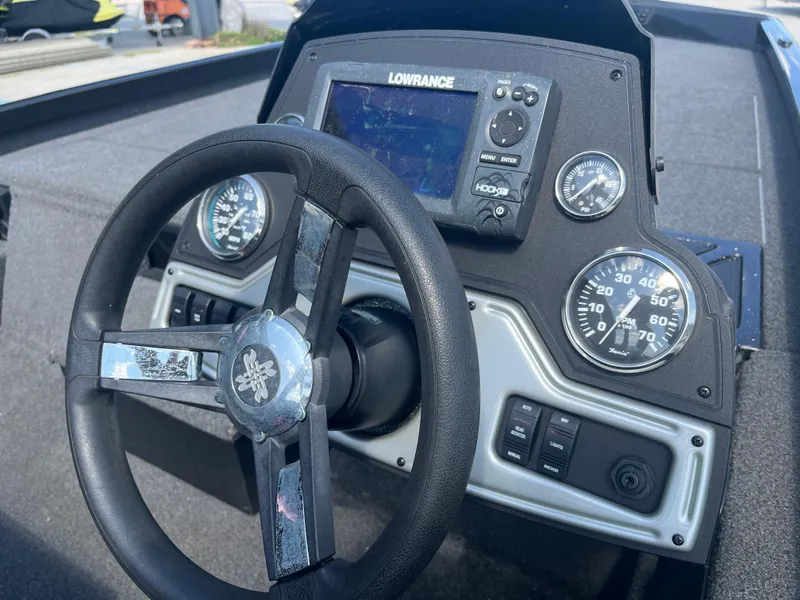 Slide: The Image of Steering wheel and dashboard of 2017 Ranger RT 198P boat with Lowrance display. - 10