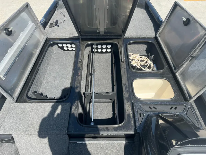 Slide: The Image of 2017 Ranger RT 198P boat storage compartments open, showcasing organized interior layout. - 11
