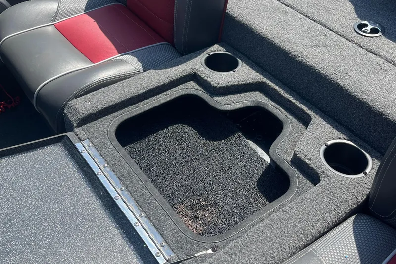 Slide: The Image of 2017 Ranger RT 198P boat interior with storage compartment and cup holders. - 13