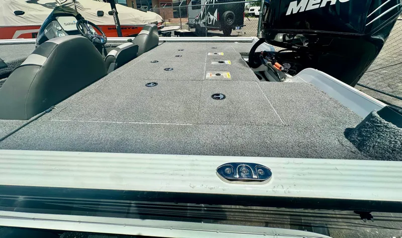 Slide: The Image of 2018 Lund 1875 Pro-V Bass boat deck with seating and Mercury engine. - 10