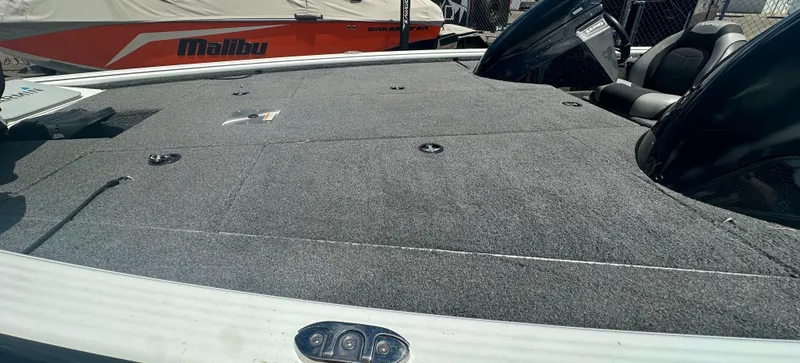 Slide: The Image of 2018 Lund 1875 Pro-V Bass boat with spacious carpeted deck. - 12