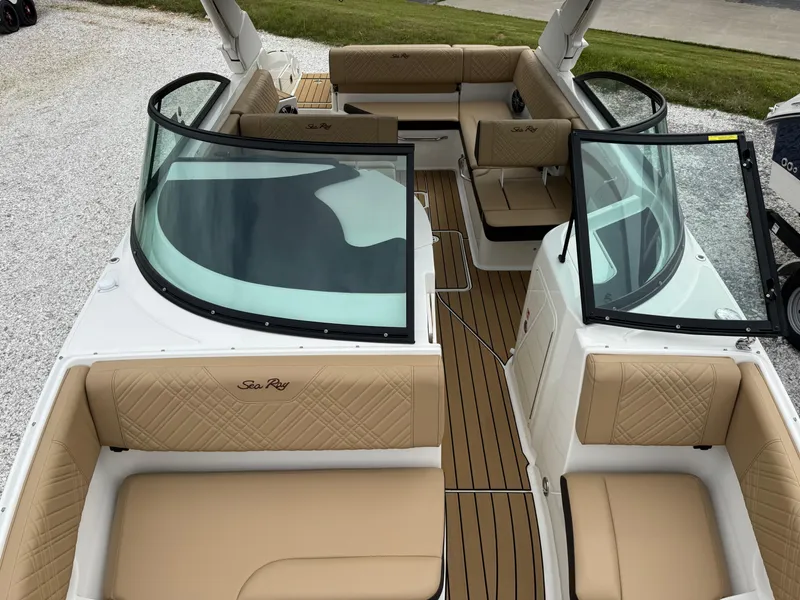 Slide: The Image of 2025 Sea Ray SDX 250 boat interior with tan seating and sleek design. - 15
