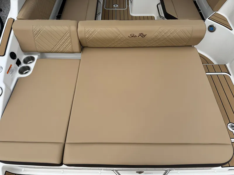 Slide: The Image of 2025 Sea Ray SDX 250 boat with tan cushioned seating and elegant design. - 6