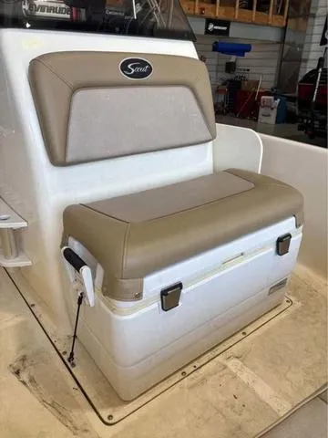 Slide: The Image of 2014 Scout 175 Sportfish boat seat with storage, beige cushion, and white base. - 10