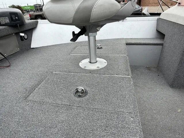 Slide: The Image of 2007 Alumacraft Lunker 165CS boat interior with gray seating and storage compartments. - 4