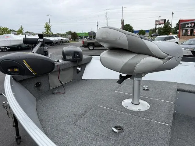 Slide: The Image of 2007 Alumacraft Lunker 165CS boat interior with seating and control panel. - 9