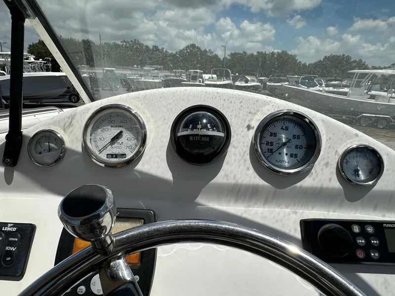 Slide: The Image of 2008 Sea Fox 216 Dual Console boat on trailer, parked outdoors under clear blue sky. - 13