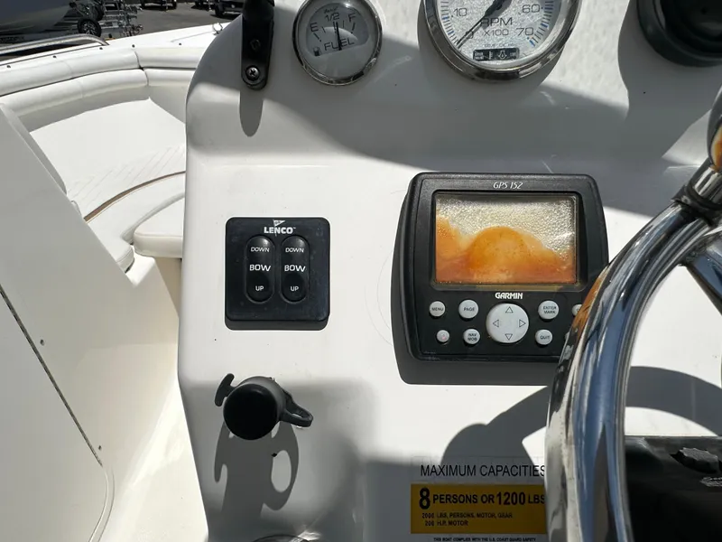 Slide: The Image of 2008 Sea Fox 216 Dual Console boat interior with seating and steering wheel. - 14