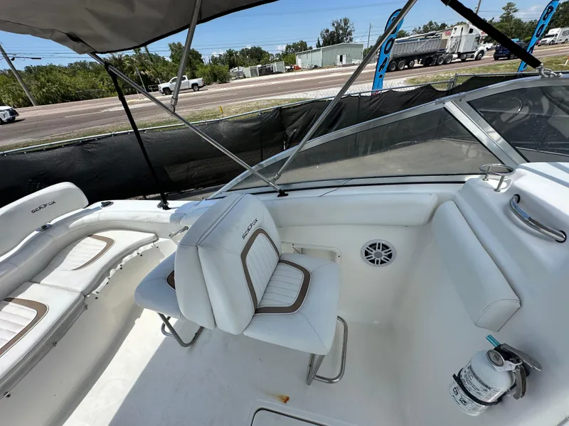 Slide: The Image of 2008 Sea Fox 216 Dual Console boat with canopy, docked in a marina. - 15
