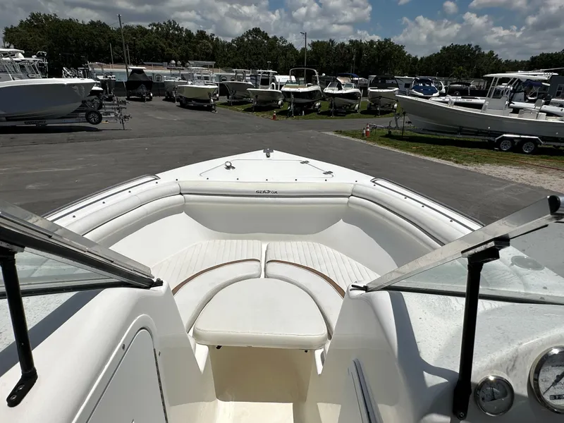 Slide: The Image of 2008 Sea Fox 216 Dual Console boat interior with seating and steering wheel. - 17