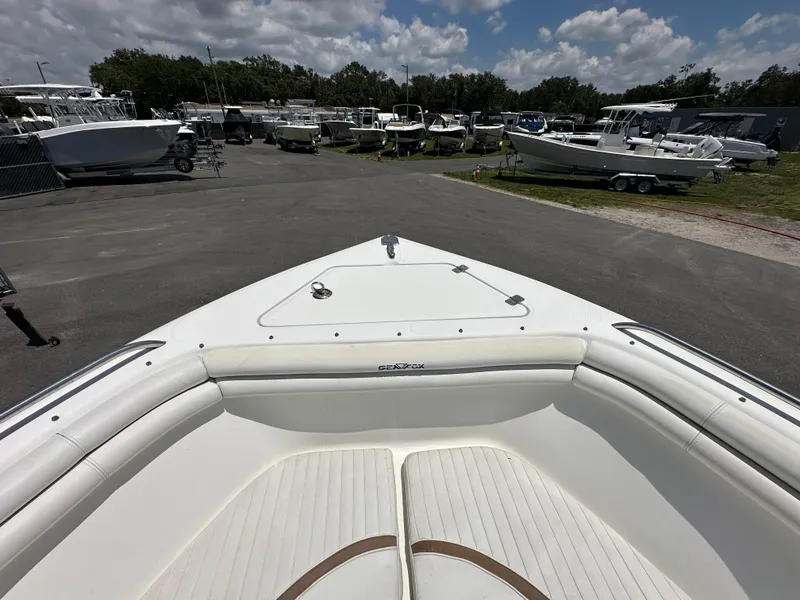 Slide: The Image of Interior of 2008 Sea Fox 216 Dual Console boat, featuring seating and storage compartments. - 20