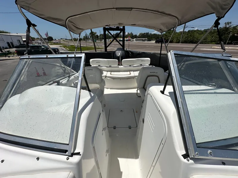 Slide: The Image of 2008 Sea Fox 216 Dual Console boat seat, white with brown accents. - 22
