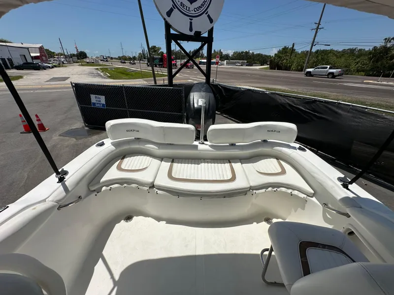 Slide: The Image of 2008 Sea Fox 216 Dual Console boat interior with steering wheel and seating. - 23