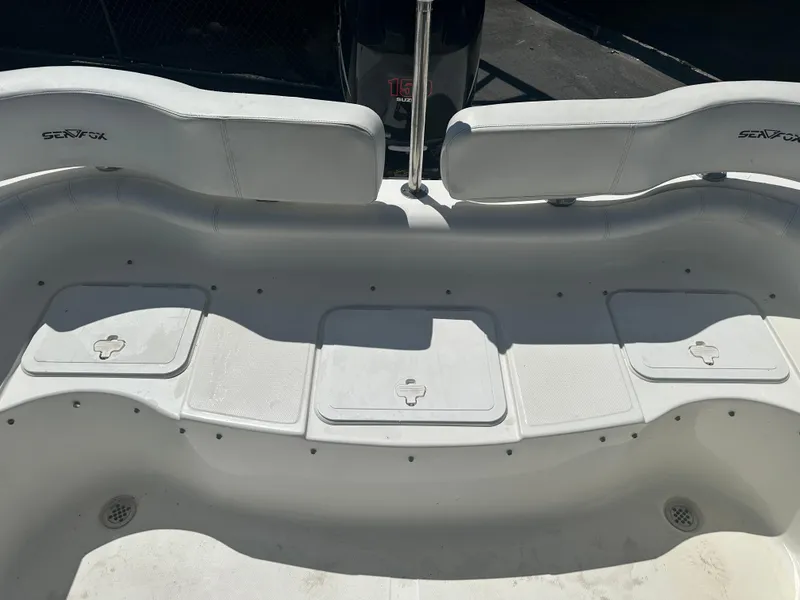 Slide: The Image of 2008 Sea Fox 216 Dual Console boat cockpit with steering wheel and controls. - 24
