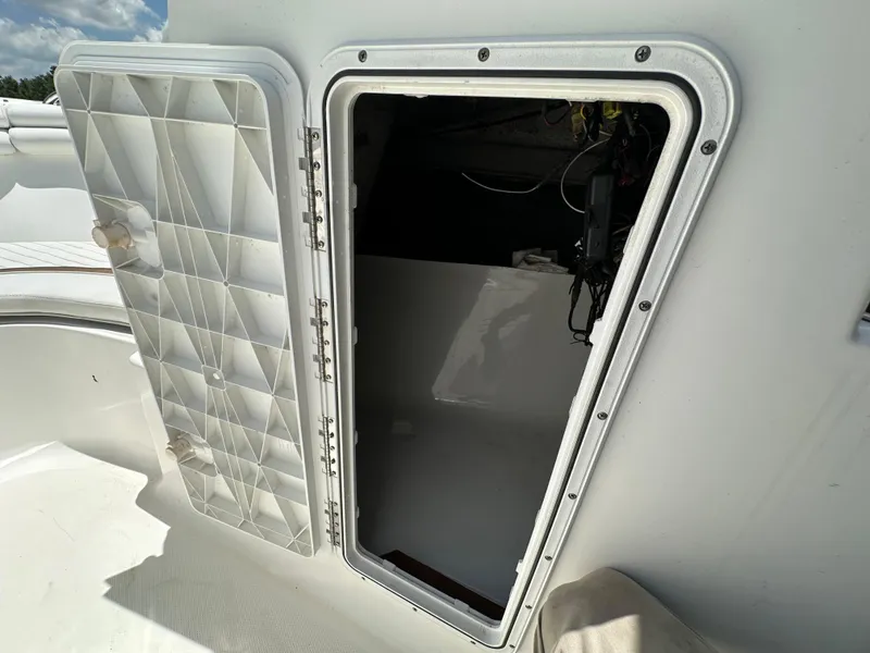 Slide: The Image of 2008 Sea Fox 216 Dual Console interior with storage compartments and control panel. - 29