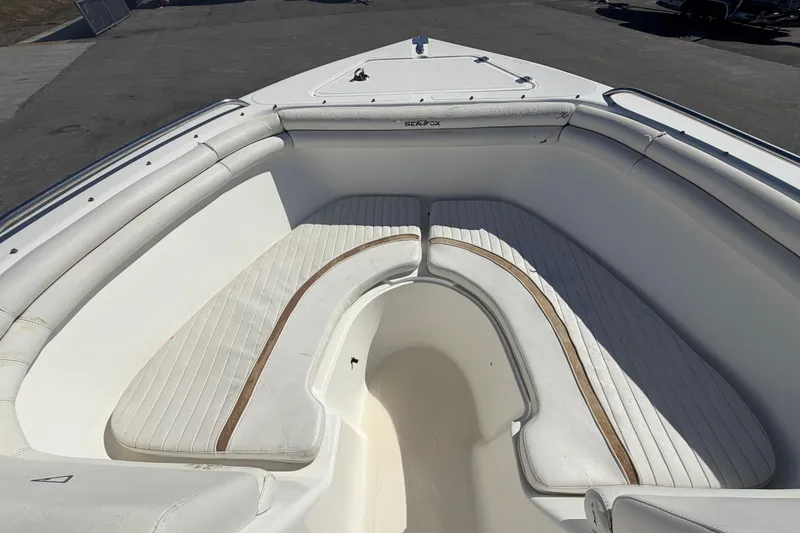 Slide: The Image of 2008 Sea Fox 216 Dual Console boat with white cushioned seating in the bow area. - 34