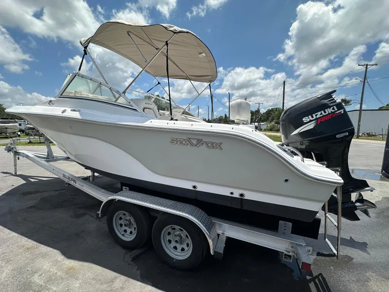 Slide: The Image of 2008 Sea Fox 216 Dual Console boat with Suzuki Four Stroke engine, parked on trailer. - 4