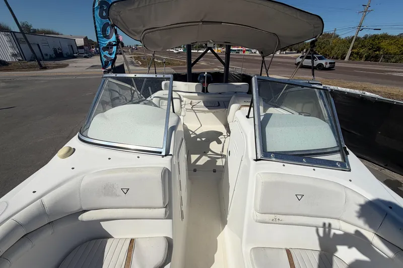 Slide: The Image of 2008 Sea Fox 216 Dual Console boat with seating and canopy, parked on roadside. - 41