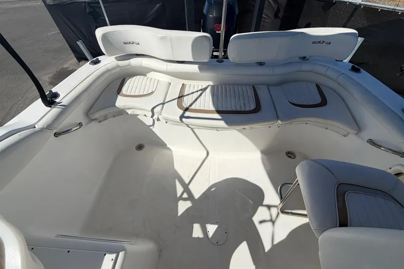 Slide: The Image of 2008 Sea Fox 216 Dual Console boat interior with seating and storage compartments. - 45