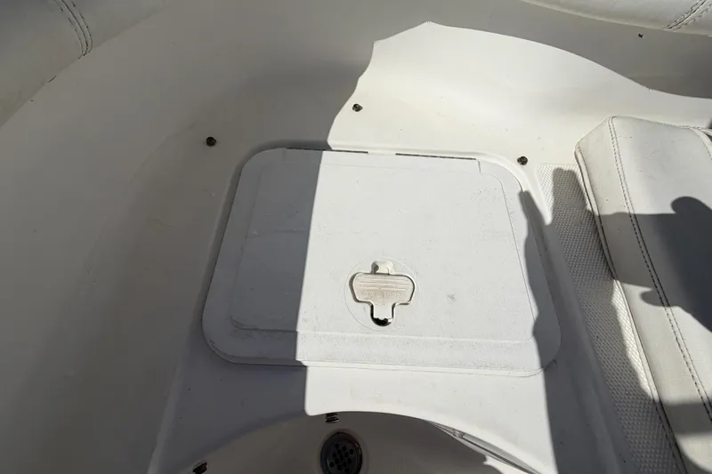 Slide: The Image of 2008 Sea Fox 216 Dual Console boat interior with storage compartment. - 46