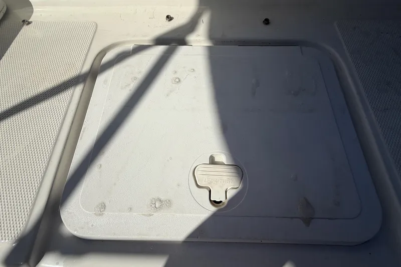 Slide: The Image of 2008 Sea Fox 216 Dual Console deck hatch with shadow and textured surface. - 48
