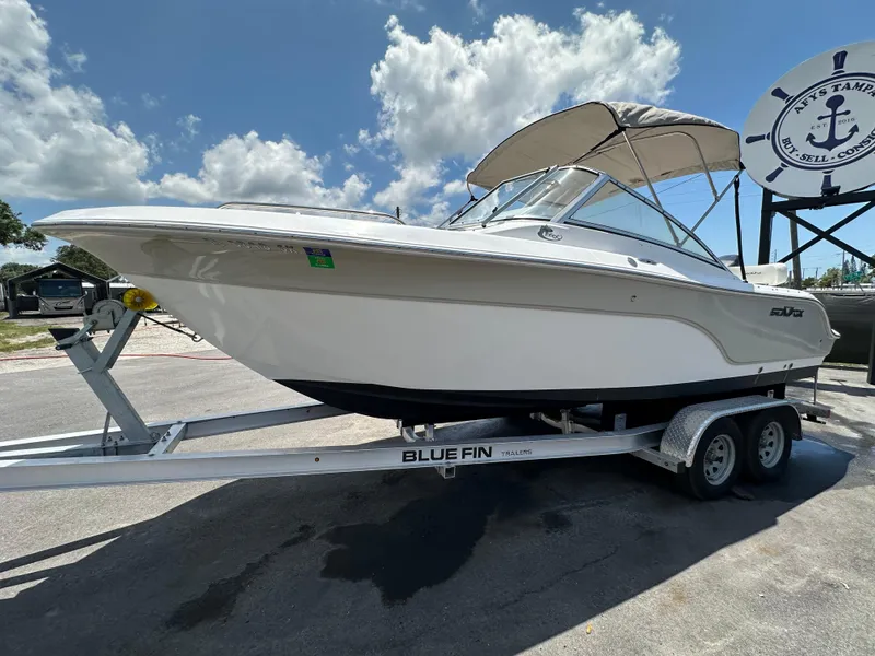 Slide: The Image of 2008 Sea Fox 216 Dual Console boat with Suzuki 150 outboard motor, parked outdoors. - 5