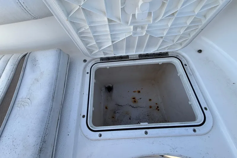 Slide: The Image of Open storage compartment on 2008 Sea Fox 216 Dual Console boat, showing interior details. - 51