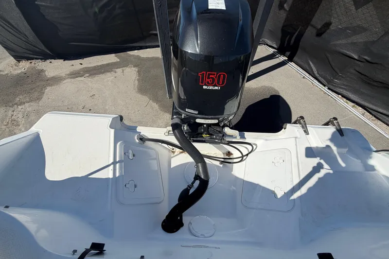 Slide: The Image of 2008 Sea Fox 216 Dual Console with Suzuki 150 outboard motor, rear deck view. - 52