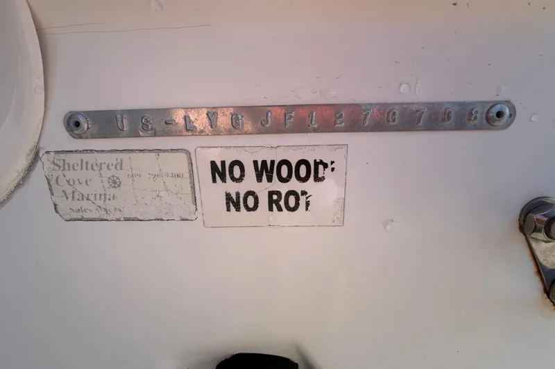 Slide: The Image of 2008 Sea Fox 216 Dual Console boat with "No Wood, No Rot" label and serial number. - 55