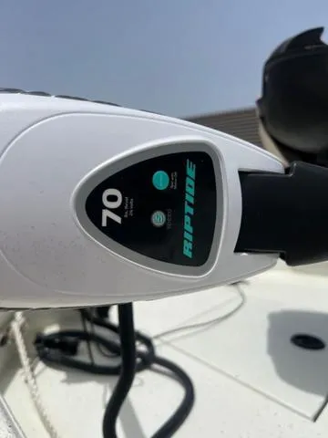 Slide: The Image of Close-up of a Riptide motor on a 2017 Excel 22' Pleasure boat. - 10