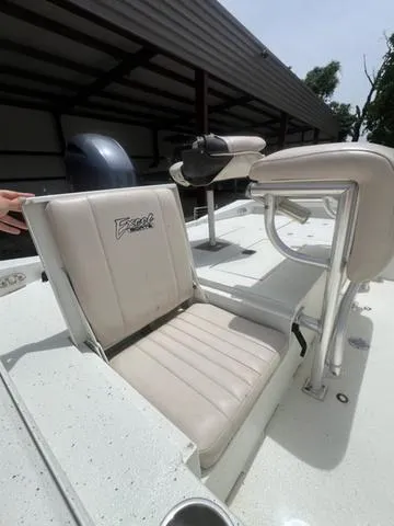 Slide: The Image of 2017 Excel 22' Pleasure boat interior with beige seating and steering console. - 12