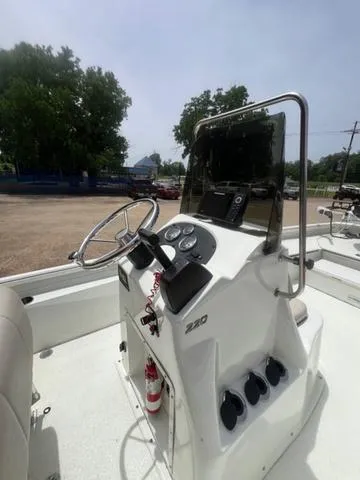 Slide: The Image of 2017 Excel 22' Pleasure boat console with steering wheel and controls. - 4