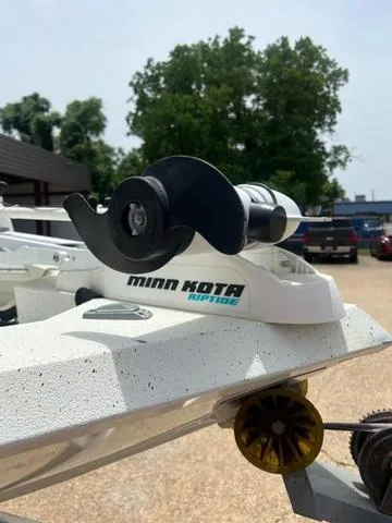 Slide: The Image of Minn Kota Raptor on 2017 Excel 22' Pleasure boat, outdoor setting. - 9