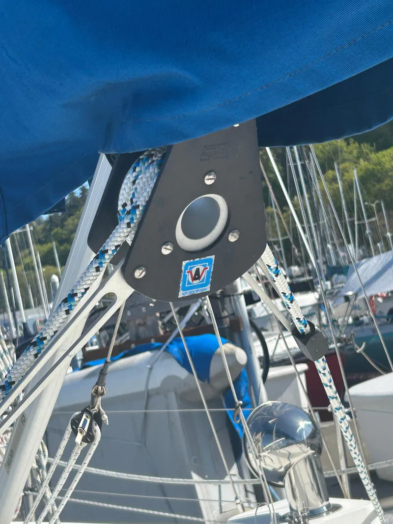 Slide: The Image of Close-up of 1973 Challenger Cruiser sailboat rigging and hardware in a marina. - 12