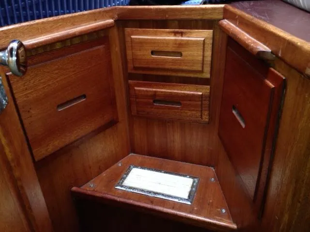 Slide: The Image of 1973 Challenger Cruiser interior with wooden cabinets and drawers. - 20