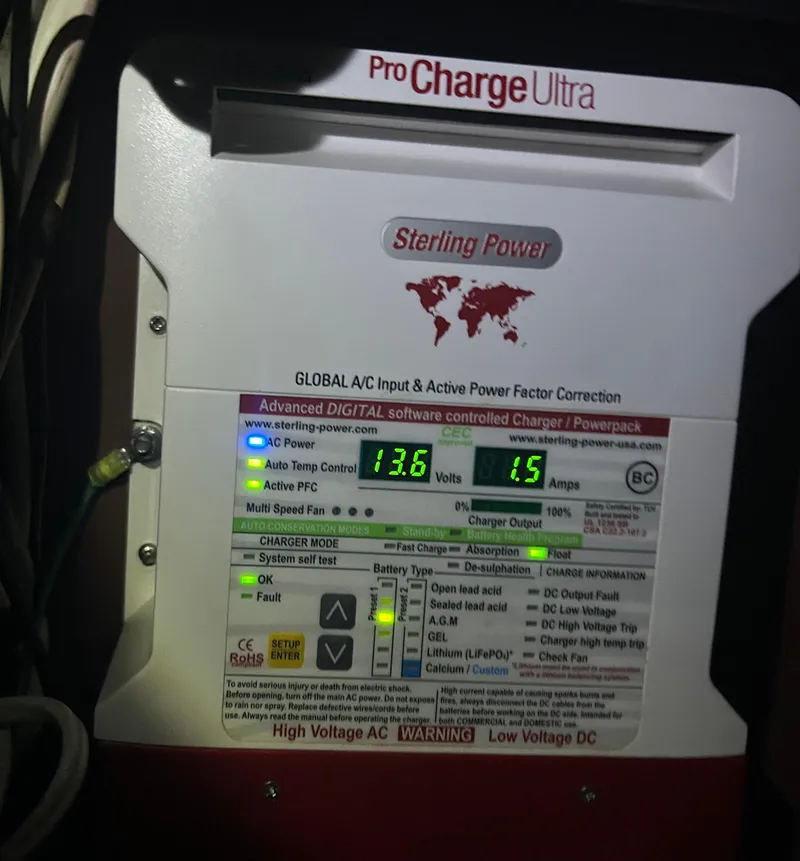 Slide: The Image of Sterling Power Pro Charge Ultra battery charger displaying voltage and current readings. - 44