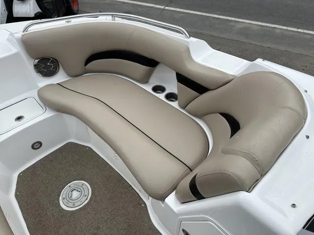 Slide: The Image of 2015 Hurricane SD 2400 I/O boat interior with beige seating and carpeted floor. - 10