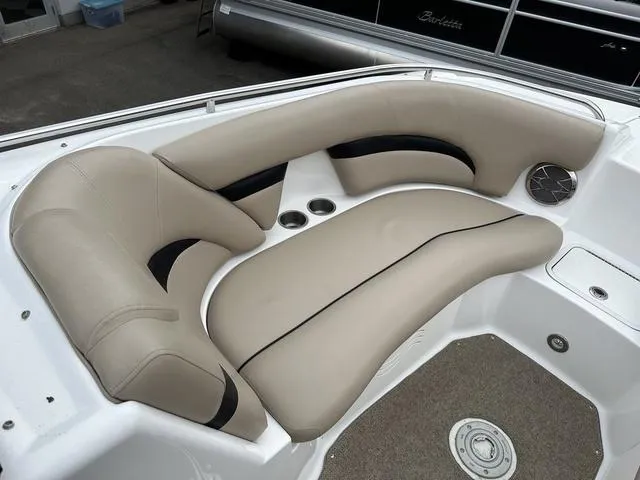 Slide: The Image of 2015 Hurricane SD 2400 I/O boat interior with beige seating and cup holders. - 11