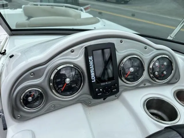 Slide: The Image of Dashboard of 2015 Hurricane SD 2400 I/O boat with gauges and Lowrance device. - 15