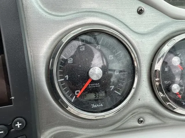 Slide: The Image of Close-up of a 2015 Hurricane SD 2400 I/O boat tachometer, showing 3300 RPM. - 17
