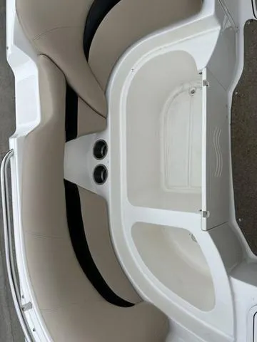 Slide: The Image of 2015 Hurricane SD 2400 I/O boat interior with beige seating and cup holders. - 18